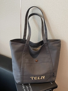 Sac fourre-tout en toile gris foncé avec broderie TELN et poche avant pour le quotidien