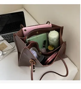Top view of spacious dark brown tote bag showing large capacity for laptop and daily essentials