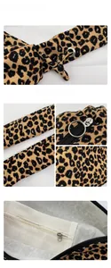 Close-up of leopard print canvas tote bag showing metal zipper and fine stitching details