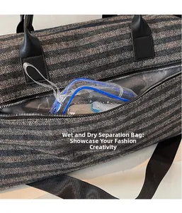 Detail view of water-resistant wet pocket with PVC lining inside a sports gym travel bag