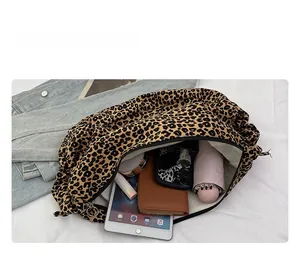Spacious interior of leopard print tote bag showing large capacity for iPad and umbrella