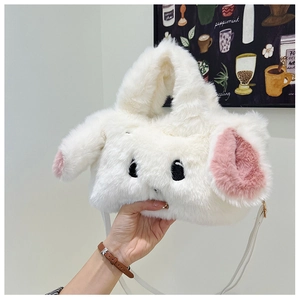 Close-up of white plush bunny handbag featuring pink long ears and embroidery detail