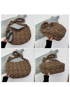 Detail view of large leopard print canvas tote bag showing multiple angles and capacity
