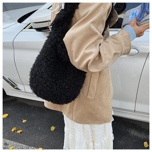 Close-up of black faux fur tote bag showing plush texture and spacious shoulder bag design