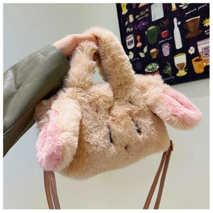 Detail of cute plush bunny ear handbag featuring soft faux fur and brown shoulder strap