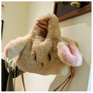 Close-up of soft khaki plush rabbit bag with long ears and brown faux leather strap