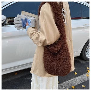 Detail of soft brown plush tote bag texture with fluffy lamb wool finish in winter style