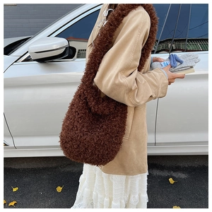 Close-up of fluffy dark brown plush tote bag made of high-quality faux lamb wool material
