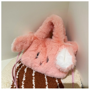 Detail of pink plush rabbit handbag featuring soft faux fur texture and long ears design