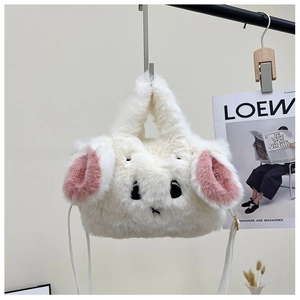 Detail of cute white plush rabbit handbag featuring soft fur and long ears on a hanger