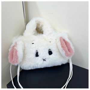 Close-up of fluffy white plush rabbit bag with pink ears and cute embroidered face