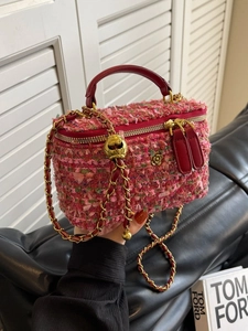 Pink tweed crossbody box bag with golden adjustable chain and metal floral clasp