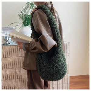 Detail of dark green plush faux fur tote bag showing rich texture and soft autumn style