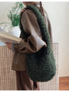 Deep green faux shearling hobo bag with wide shoulder strap for autumn and winter outfits