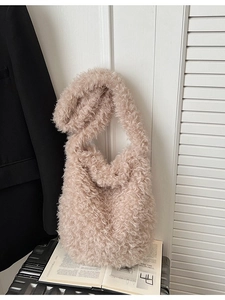 Beige faux fur teddy tote bag with plush wide strap for elegant winter styling