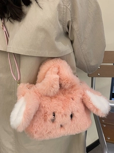 Cute pink plush rabbit handbag with long ears and detachable strap for women's winter fashion