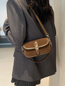 Vintage dark brown square shoulder bag in mixed leather texture shown on model