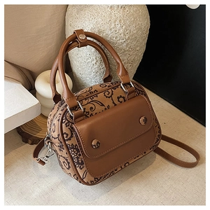 Detailed top view of retro brown floral mini boston bag with top handles and strap