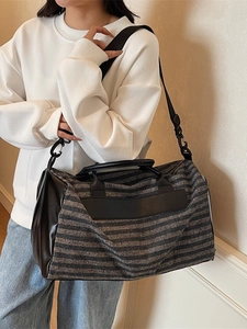 Striped sports gym bag with shoe compartment and adjustable shoulder strap for travel