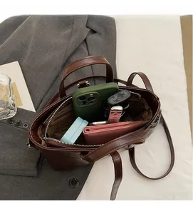 Top view of deep brown bucket bag interior showing spacious capacity and inner pockets