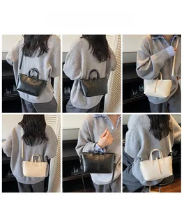 Multiple views of casual bucket bag in black and cream leather with adjustable straps