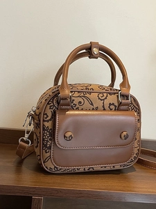 Vintage floral printed mini handbag with brown leather trim and detachable shoulder strap