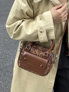 Retro floral print crossbody handbag in tan leather with front flap pocket and gold hardware