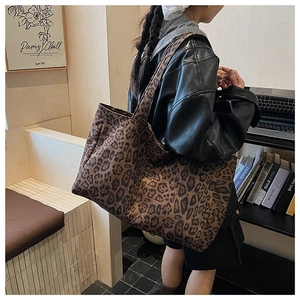 Detailed view of large leopard print tote bag made of thick canvas fabric for daily use