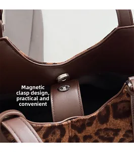 Close-up of leopard print tote bag featuring a silver magnetic clasp for easy closure