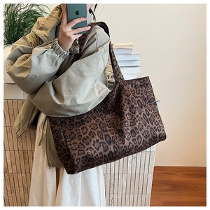 Detail of the leopard print pattern and thick canvas texture on the large tote bag