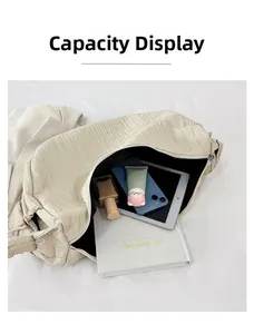 Detail showing high-capacity interior of the off-white pleated tote bag with black lining