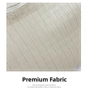 Close-up of pleated beige fabric detail with high-quality zipper and texture