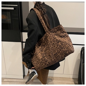 Detail showing the large capacity leopard print tote bag on shoulder for daily commute