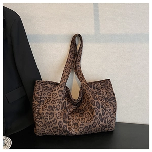 Close-up of leopard print canvas tote bag showing the high-quality fabric texture and large strap