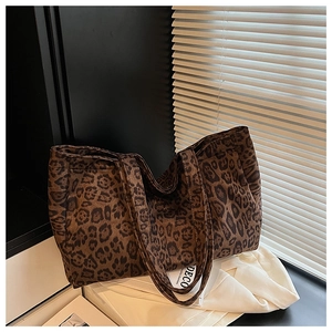 Detail of leopard print tote bag texture and soft canvas material in soft natural light