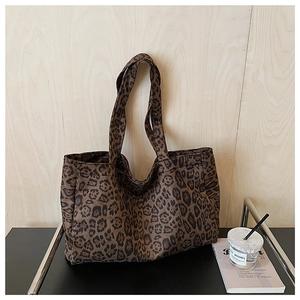 Close-up of leopard print tote bag with soft fabric texture and durable shoulder straps