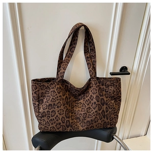 Close-up of leopard print canvas tote bag showing the texture and large capacity design