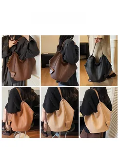 Detail of woven texture and slouchy drape on the large capacity hobo tote bag in various colors