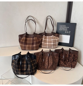 Detailed close-up of vintage leopard and plaid patterns on these stylish tote bags