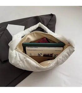 Top view of large white cloud bag showing spacious interior with heart quilted pattern