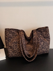 Large leopard print tote bag with spacious interior and wide straps for autumn and winter