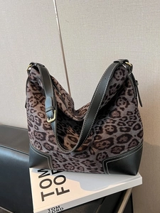 Retro leopard print tote bag with black leather trim and adjustable shoulder straps