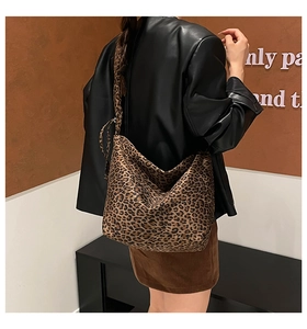 Leopard print large capacity tote bag shown on shoulder for a stylish casual look