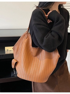 Brown woven tote bag with matching mini pouch and stylish V-shape braid for autumn