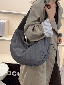Minimalist dark grey pleated tote bag with drawstring for women in a stylish crescent design