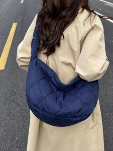 Navy blue large capacity quilted shoulder bag featuring heart pattern and crescent shape