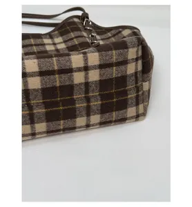 Close-up of the reinforced bottom and sturdy side structure of this plaid tote bag