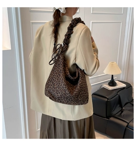 Detail of leopard print tote bag featuring a trendy scrunchie style ruched shoulder strap