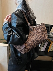 Vintage leopard print suede tote bag with slim brown leather strap for shoulder wear