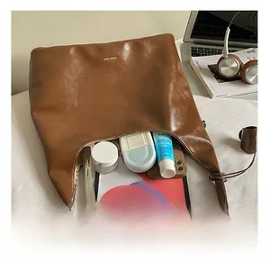 Interior storage space of the brown retro tote bag showing large capacity for essentials